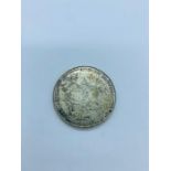 : A 1000 Escudos silver coin from Portugal