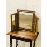 A gilt dressing table mirror