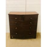 A large mahogany bow fronted chest of drawers, two over three with turned knobs (H97cm D49cm