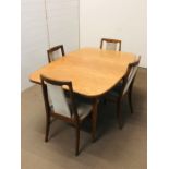 A G Plan extendable dining table with middle insert, rectangular in shape with rounded corners and