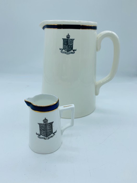 A pair of cream jugs with navy rims by Dunn and Bennett & Co