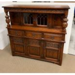 A mahogany Chiffonier with panel doors flanked by turned coloums