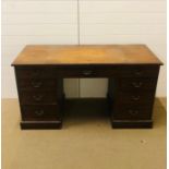 A twin pedestal desk with central drawer circa 1940's (W185cm D67cm H92cm)