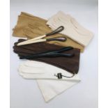 A selection of four pairs of vintage leather gloves and two glove stretchers