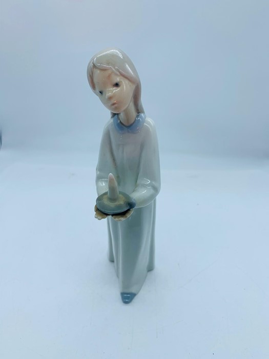 Lladro figure of a girl with candle