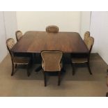 A regency dining table on a central support with four reeded splayed legs on brass castors with