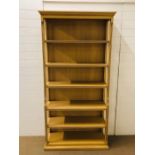 A large modern pale beech open bookcase (H205cm W103cm D34cm)