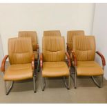 Six leather boardroom chairs with wooden arm rests on chrome frames