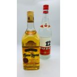 A bottle of Cuerro Tequila 1litre and a bottle of Ouzo 12 1litre