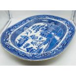 A Willow Pattern charger or platter.