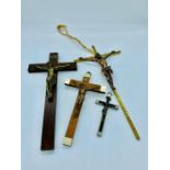 Four metal and wood crucifixes