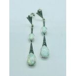 A pair of silver and opal drop earrings