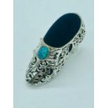A large silver Victorian shoe style pincushion with opal cabochon
