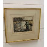 A framed signed print of a Trout Fisherman