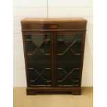An inlaid mahogany display cabinet/ bookcase with glazed doors enclosing three shelves (W88cm H122cm