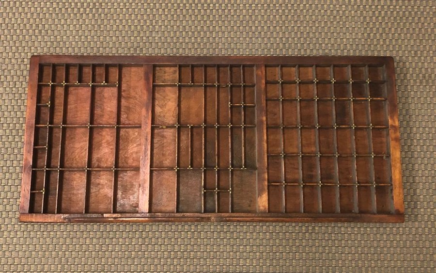 A printers tray with brass dividers (82cm x 37cm)