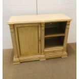 An ornate cream and gold sideboard with cupboard shelving and one drawer