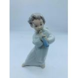 Lladro figure of an angel playing a flute