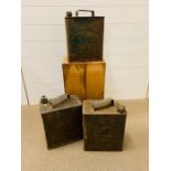 Three metal petrol cans,two Shell and one Esso