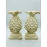 A pair of resin pineapple bookends