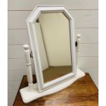 A white dressing table mirror