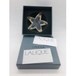 A Lalique Oceania Paperweight in original box with paperwork