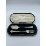 A hallmarked silver boxed christening set, spoon and fork