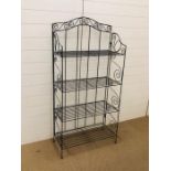 A decorative metal shelving unit