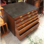 A six drawer plan chest with a painted top and solid brass recessed flush handles and label plaques.