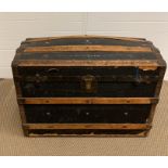 A travel chest/steamer trunk, metal and wood banded