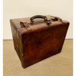 A brown leather travel trunk by M. Wurzl & Sohne, Wien-Carlsbad, Austria