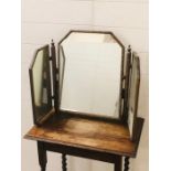 A gilt dressing table top mirror