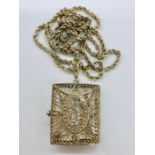 A Silver pendant and chain with prayer box containing a miniature Koran.