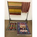 A selection of three small rugs and a throw AF