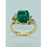 An 18ct gold Emerald and Diamond Ring (size M)