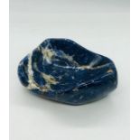 A polished blue bowl, possibly marble and of Italian design. (13cm x 10cm)