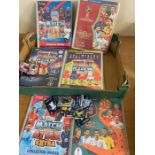 A selection of eight Match Attax albums with cards