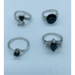 A selection of four rings marked 10kt. (13.8g)