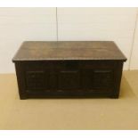 A large carved oak coffer with hinged lid circa 1730 (W139cm D57cm H60cm)