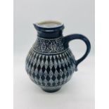 A blue and white stoneware jug with maker's mark to the base- possibly of Italian origin