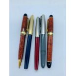 A collection of pens to include Sheaffer Navy Gold, Parker 51 Vac and a Parker pen