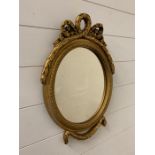 Small gilt framed oval wall mirror