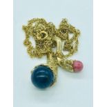 A 9ct gold pendant and chain set with semi precious stones (total weight 11.05g)