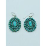 A pair of silver and turquoise art deco style drop earrings