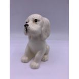 A Beswick figure of a seated puppy