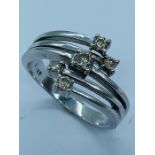 A 9ct white gold five stone ring (3.6g)