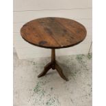 An oak occasional table in arts and craft style