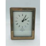 A hallmarked silver Witney & Co clock.