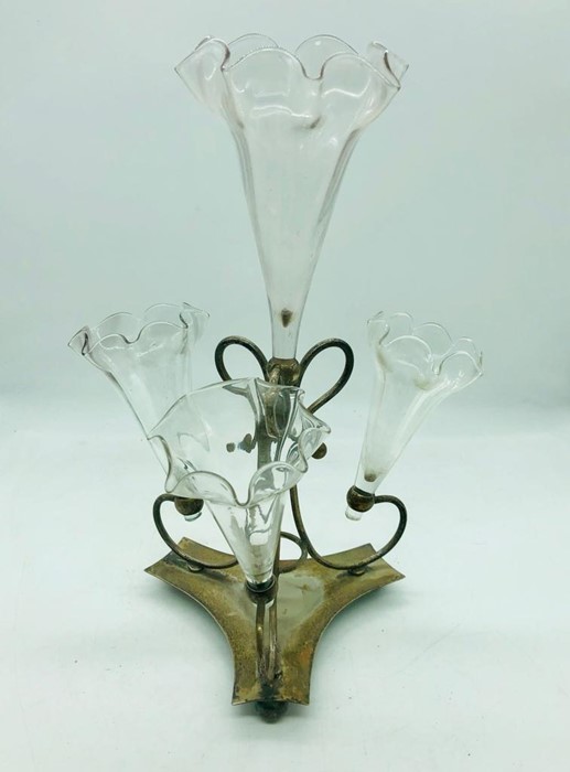 A white metal and glass epern