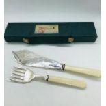 A boxed set of silver plated Fish servers